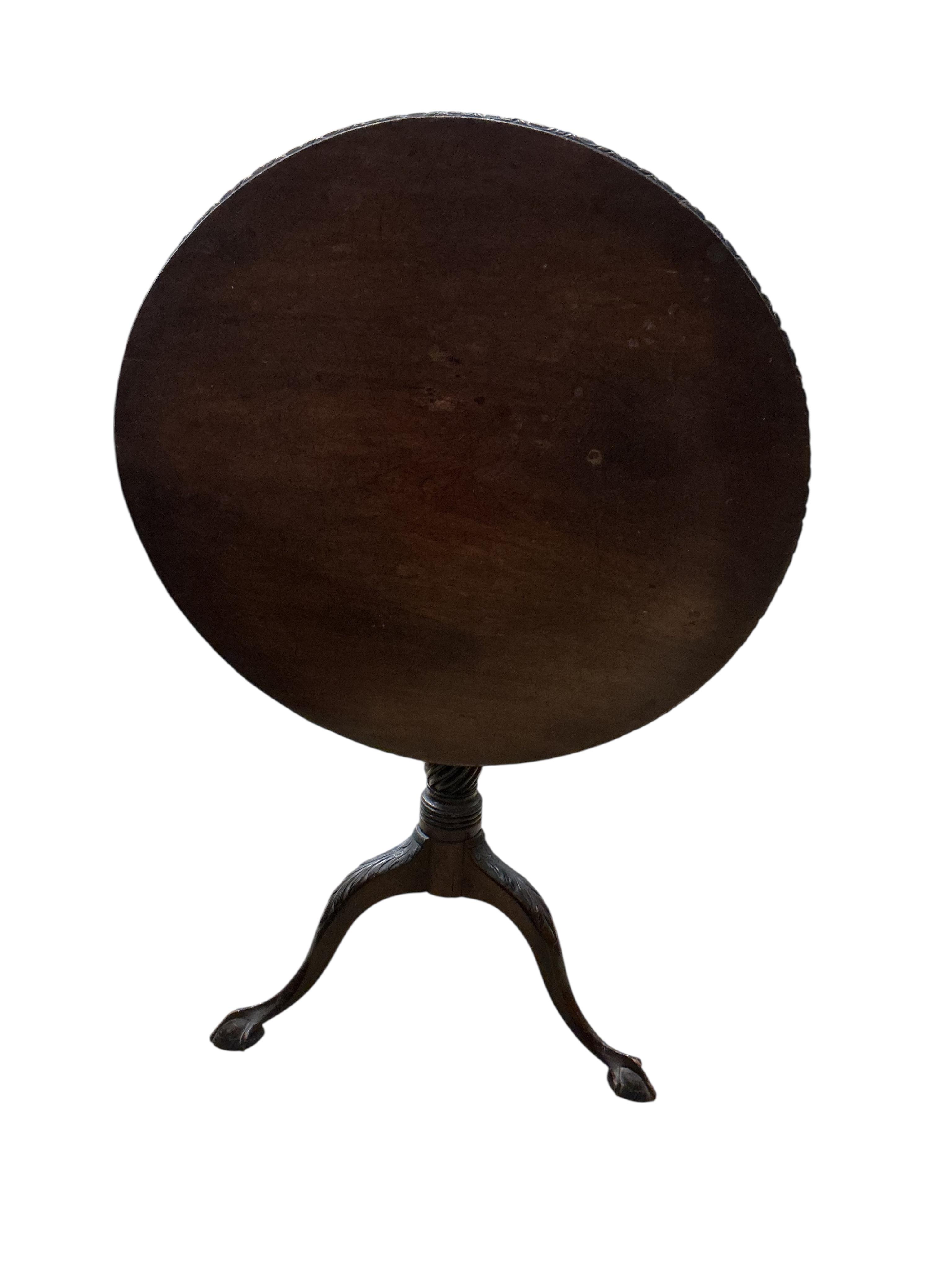 A George III style circular mahogany tilt top tripod tea table, diameter 74cm, height 70cm